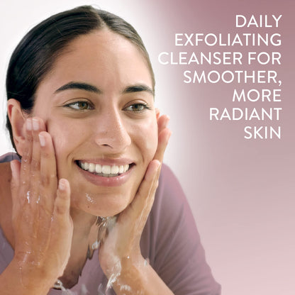 Woman washing her face with a Cetaphil Healthy Radiance PHA Exfoliating Face Wash on a pink background